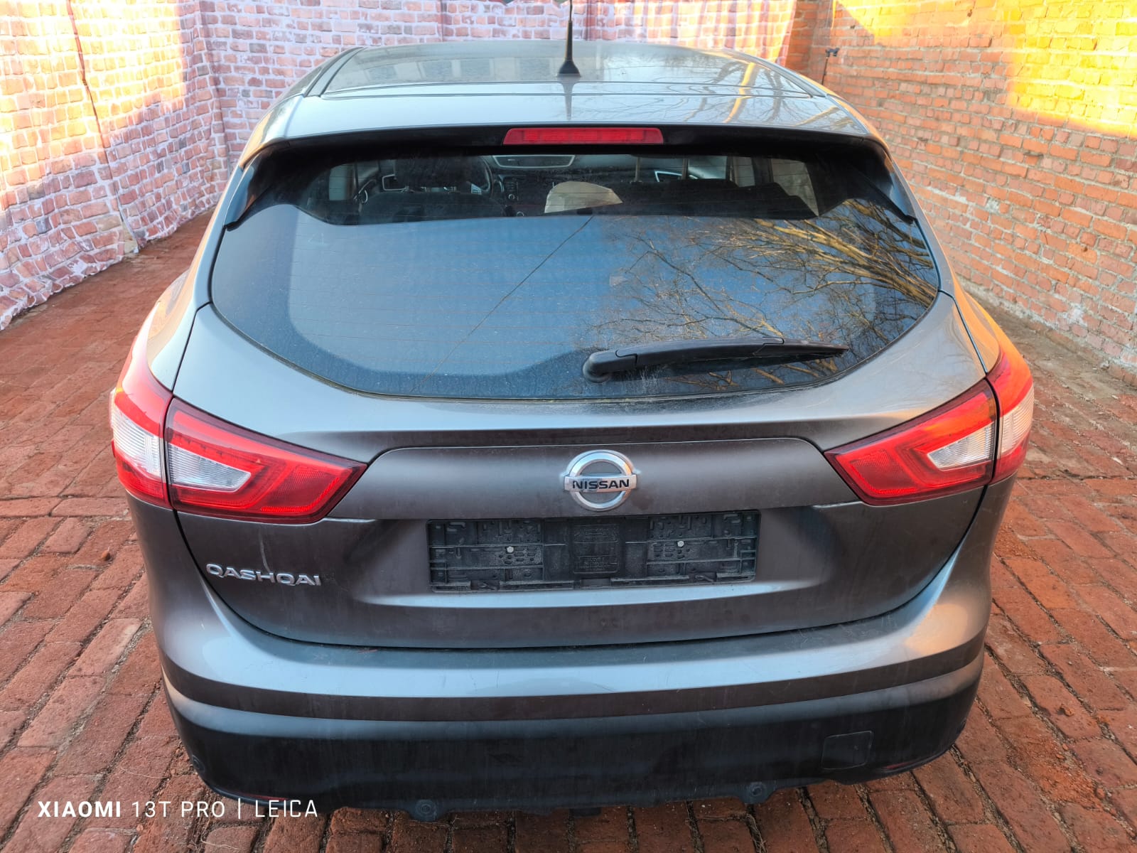 Rückansicht eines gebrauchten Nissan Qashqai zur Fahrzeugbewertung für den Auto verkaufen Service in Frechen